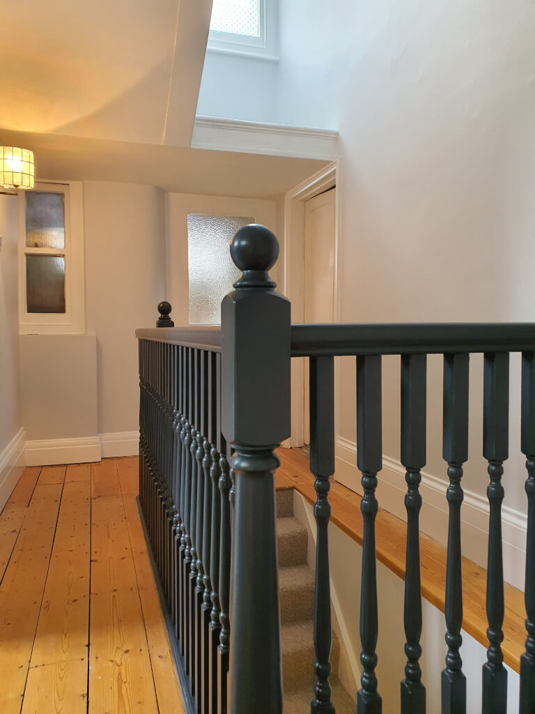Hallway update with bannister & spindles painted in a flat eggshell.